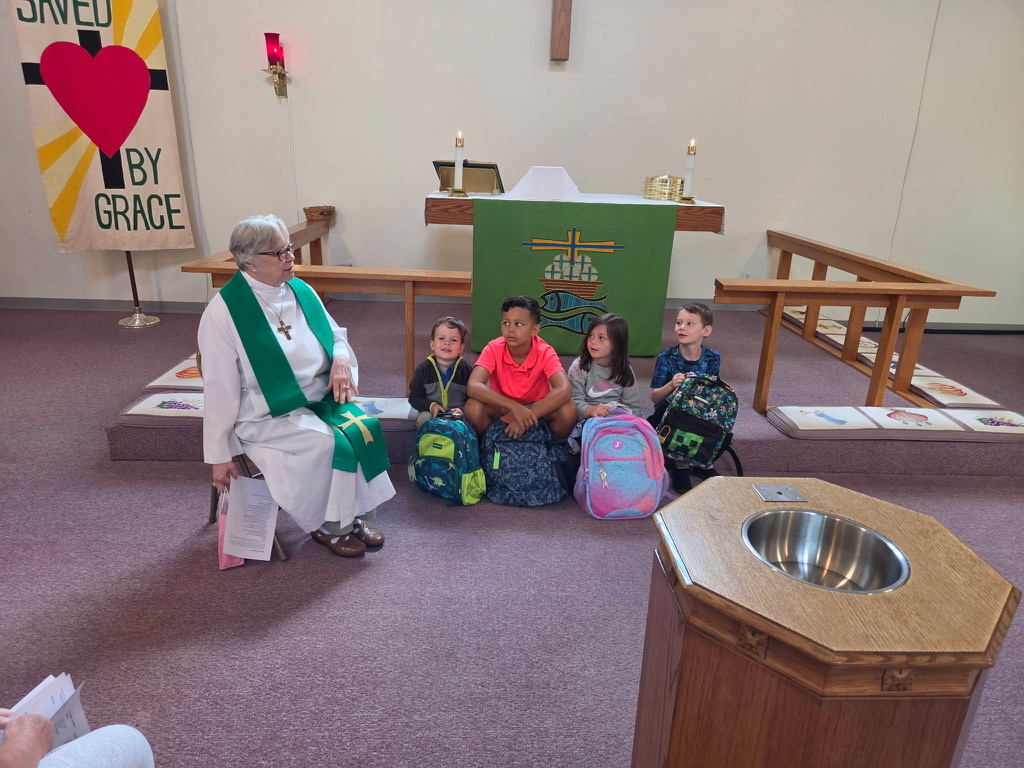 Pastor Kay leading a children's message at Triumphant Cross Lutheran Church